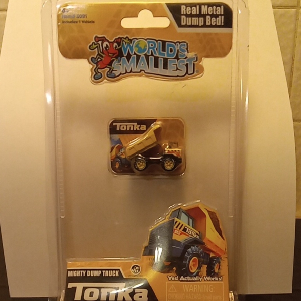 Tiny tonka truck. About an inch and a 1/2.